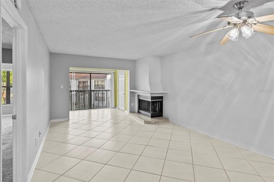 This remodeled second-floor unit features a fireplace and a on Feather Sound Country Club in Florida - for sale on GolfHomes.com, golf home, golf lot