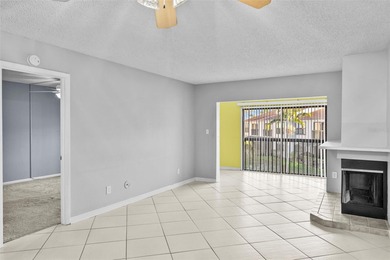 This remodeled second-floor unit features a fireplace and a on Feather Sound Country Club in Florida - for sale on GolfHomes.com, golf home, golf lot