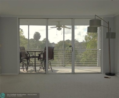 OUTSTANDING GOLF COURSE VIEWS from this 3 bedroom 2 bath bright on Palm-Aire Country Club and Resort - Palms in Florida - for sale on GolfHomes.com, golf home, golf lot