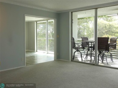 OUTSTANDING GOLF COURSE VIEWS from this 3 bedroom 2 bath bright on Palm-Aire Country Club and Resort - Palms in Florida - for sale on GolfHomes.com, golf home, golf lot