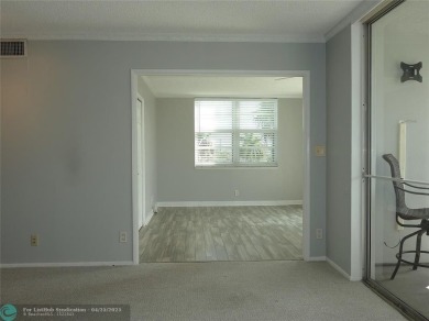 OUTSTANDING GOLF COURSE VIEWS from this 3 bedroom 2 bath bright on Palm-Aire Country Club and Resort - Palms in Florida - for sale on GolfHomes.com, golf home, golf lot