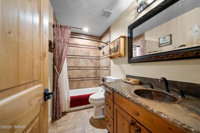 Discover elegant living paired with the charm of the southwest on Pinetop Lakes Country Club in Arizona - for sale on GolfHomes.com, golf home, golf lot