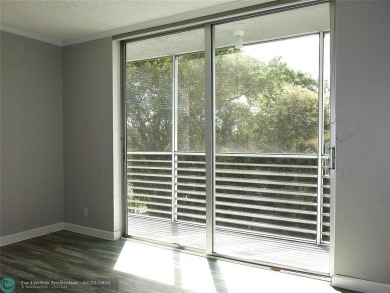 OUTSTANDING GOLF COURSE VIEWS from this 3 bedroom 2 bath bright on Palm-Aire Country Club and Resort - Palms in Florida - for sale on GolfHomes.com, golf home, golf lot