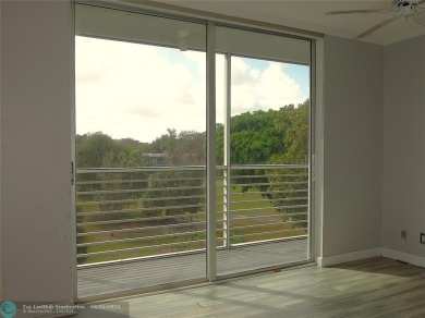 OUTSTANDING GOLF COURSE VIEWS from this 3 bedroom 2 bath bright on Palm-Aire Country Club and Resort - Palms in Florida - for sale on GolfHomes.com, golf home, golf lot