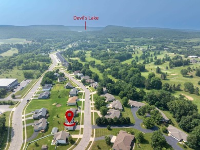 Spacious and versatile near Devil's Lake State Park. This on Baraboo Country Club in Wisconsin - for sale on GolfHomes.com, golf home, golf lot
