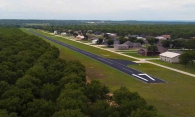 PILOTS! FLY IN to view this stunning 1.28-acre homesite with on Pecan Plantation Country Club in Texas - for sale on GolfHomes.com, golf home, golf lot