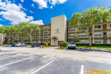 Stunning 2 bed 2 bath updated lakefront corner unit in the on Flamingo Lakes Country Club in Florida - for sale on GolfHomes.com, golf home, golf lot