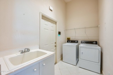 This beautifully maintained 4-bedroom, 3-bathroom pool home on on The Club At Pelican Bay - North Course in Florida - for sale on GolfHomes.com, golf home, golf lot