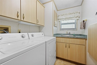 Enjoy the best of Florida living in this turnkey furnished home on Maple Leaf Golf and Country Club in Florida - for sale on GolfHomes.com, golf home, golf lot
