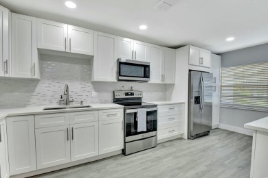 This beautifully renovated 2-bedroom, 2-bathroom main-level on Hunters Run Golf and Country Club in Florida - for sale on GolfHomes.com, golf home, golf lot