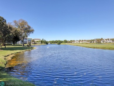 55+1/1.5*LAKE VIEW FROM ENCLOSED PATIO  CENTRAL PARK-LIKE on Wynmoor Golf Course in Florida - for sale on GolfHomes.com, golf home, golf lot