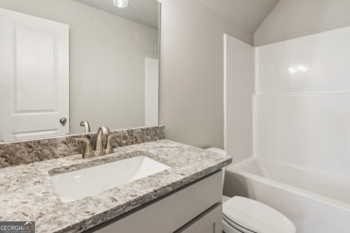 Welcome home to a beautifully crafted new construction home by a on Traditions of Braselton Golf Club in Georgia - for sale on GolfHomes.com, golf home, golf lot