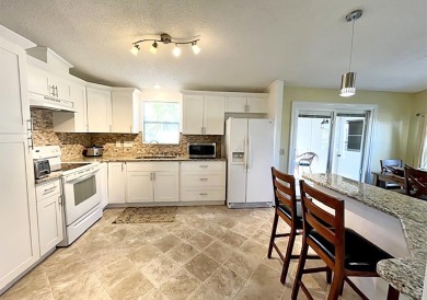 This charming, renovated 2-bedroom, 2-bathroom home is situated on Del Tura Golf and Country Club in Florida - for sale on GolfHomes.com, golf home, golf lot