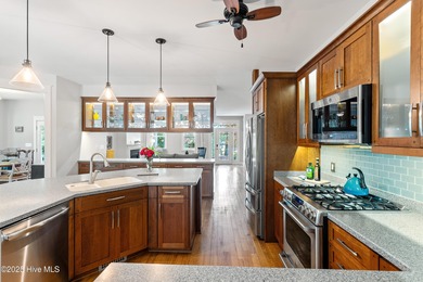 Nestled in a quiet cul-de-sac and backed by a serene pond shaded on Members Club At St. James Plantation in North Carolina - for sale on GolfHomes.com, golf home, golf lot