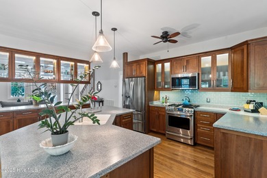 Nestled in a quiet cul-de-sac and backed by a serene pond shaded on Members Club At St. James Plantation in North Carolina - for sale on GolfHomes.com, golf home, golf lot