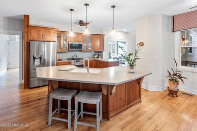 Nestled in a quiet cul-de-sac and backed by a serene pond shaded on Members Club At St. James Plantation in North Carolina - for sale on GolfHomes.com, golf home, golf lot