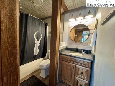 Escape to the mountains in this charming fully furnished on Sugar Mountain Golf Course in North Carolina - for sale on GolfHomes.com, golf home, golf lot