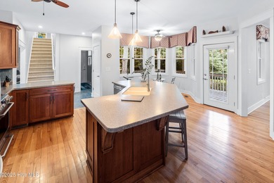 Nestled in a quiet cul-de-sac and backed by a serene pond shaded on Members Club At St. James Plantation in North Carolina - for sale on GolfHomes.com, golf home, golf lot