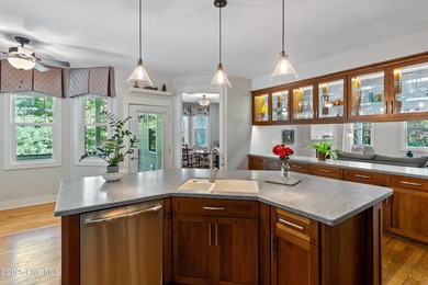 Nestled in a quiet cul-de-sac and backed by a serene pond shaded on Members Club At St. James Plantation in North Carolina - for sale on GolfHomes.com, golf home, golf lot