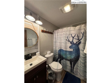 Escape to the mountains in this charming fully furnished on Sugar Mountain Golf Course in North Carolina - for sale on GolfHomes.com, golf home, golf lot