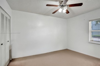 This spacious 2-bedroom, 2-bathroom condo in Tamarac's desirable on Colony West Country Club in Florida - for sale on GolfHomes.com, golf home, golf lot