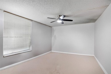 This spacious 2-bedroom, 2-bathroom condo in Tamarac's desirable on Colony West Country Club in Florida - for sale on GolfHomes.com, golf home, golf lot