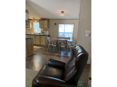 Exceptional 3-Bedroom, 2-Bath Manufactured Home on Prime Corner on Sierra Del Rio Golf Club in New Mexico - for sale on GolfHomes.com, golf home, golf lot
