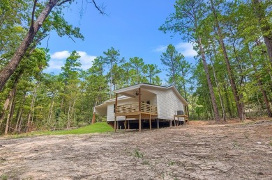 Nestled in the heart of Rayburn Country, this new construction on Rayburn Country Club in Texas - for sale on GolfHomes.com, golf home, golf lot