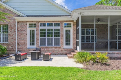 This elegant all-brick, one-level home is perfectly situated in on Reserve Club At St James Plantation in North Carolina - for sale on GolfHomes.com, golf home, golf lot