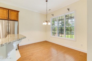 This elegant all-brick, one-level home is perfectly situated in on Reserve Club At St James Plantation in North Carolina - for sale on GolfHomes.com, golf home, golf lot