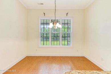 This elegant all-brick, one-level home is perfectly situated in on Reserve Club At St James Plantation in North Carolina - for sale on GolfHomes.com, golf home, golf lot