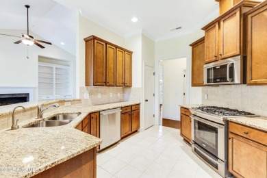 This elegant all-brick, one-level home is perfectly situated in on Reserve Club At St James Plantation in North Carolina - for sale on GolfHomes.com, golf home, golf lot