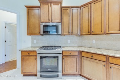 This elegant all-brick, one-level home is perfectly situated in on Reserve Club At St James Plantation in North Carolina - for sale on GolfHomes.com, golf home, golf lot