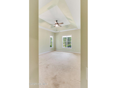 This elegant all-brick, one-level home is perfectly situated in on Reserve Club At St James Plantation in North Carolina - for sale on GolfHomes.com, golf home, golf lot