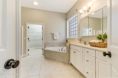 This elegant all-brick, one-level home is perfectly situated in on Reserve Club At St James Plantation in North Carolina - for sale on GolfHomes.com, golf home, golf lot