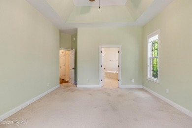 This elegant all-brick, one-level home is perfectly situated in on Reserve Club At St James Plantation in North Carolina - for sale on GolfHomes.com, golf home, golf lot