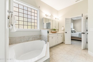 This elegant all-brick, one-level home is perfectly situated in on Reserve Club At St James Plantation in North Carolina - for sale on GolfHomes.com, golf home, golf lot