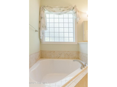 This elegant all-brick, one-level home is perfectly situated in on Reserve Club At St James Plantation in North Carolina - for sale on GolfHomes.com, golf home, golf lot