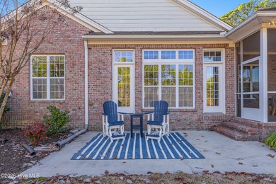 This elegant all-brick, one-level home is perfectly situated in on Reserve Club At St James Plantation in North Carolina - for sale on GolfHomes.com, golf home, golf lot