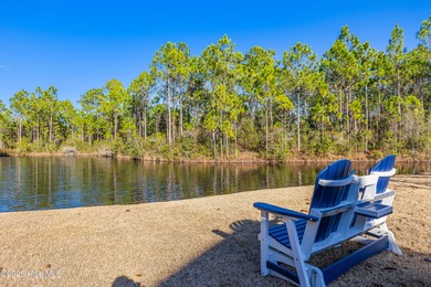 This elegant all-brick, one-level home is perfectly situated in on Reserve Club At St James Plantation in North Carolina - for sale on GolfHomes.com, golf home, golf lot
