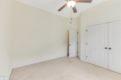 This elegant all-brick, one-level home is perfectly situated in on Reserve Club At St James Plantation in North Carolina - for sale on GolfHomes.com, golf home, golf lot