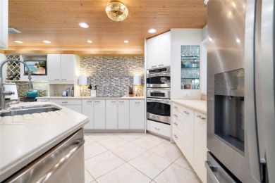 This expansive villa offers the space and comfort of a private on Longboat Key Golf Club Resort in Florida - for sale on GolfHomes.com, golf home, golf lot