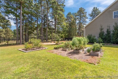 3 car garage, nearly 1 acre lot, screened porch and primary on Bluff Golf Links in North Carolina - for sale on GolfHomes.com, golf home, golf lot