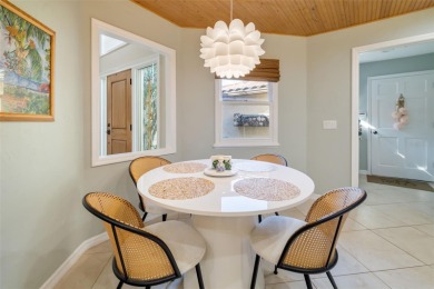 This expansive villa offers the space and comfort of a private on Longboat Key Golf Club Resort in Florida - for sale on GolfHomes.com, golf home, golf lot