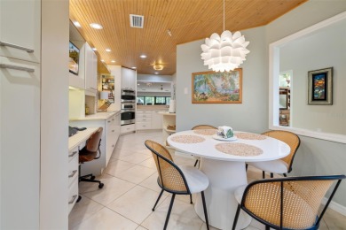 This expansive villa offers the space and comfort of a private on Longboat Key Golf Club Resort in Florida - for sale on GolfHomes.com, golf home, golf lot