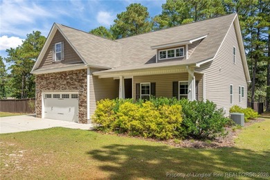 3 car garage, nearly 1 acre lot, screened porch and primary on Bluff Golf Links in North Carolina - for sale on GolfHomes.com, golf home, golf lot