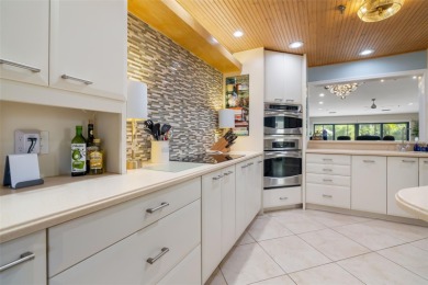 This expansive villa offers the space and comfort of a private on Longboat Key Golf Club Resort in Florida - for sale on GolfHomes.com, golf home, golf lot