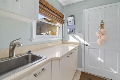 This expansive villa offers the space and comfort of a private on Longboat Key Golf Club Resort in Florida - for sale on GolfHomes.com, golf home, golf lot