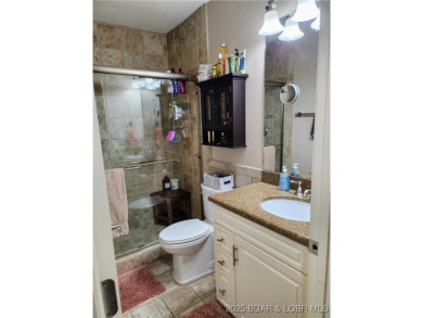 One-of-a-Kind Old Kinderhook Condo - Stunning Lake  Golf Course on The Club At Old Kinderhook in Missouri - for sale on GolfHomes.com, golf home, golf lot