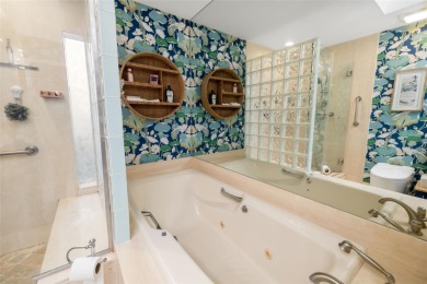 This expansive villa offers the space and comfort of a private on Longboat Key Golf Club Resort in Florida - for sale on GolfHomes.com, golf home, golf lot